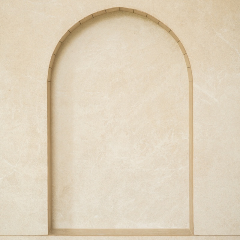 Arched niche in a travertine bathroom wall